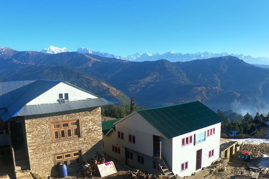 Local Houses on Pikey Peak Trek with Mount Everest View in Distance